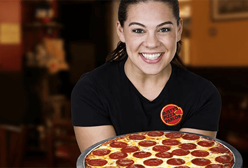 Woman holding Rusty's Pepperoni Pizza